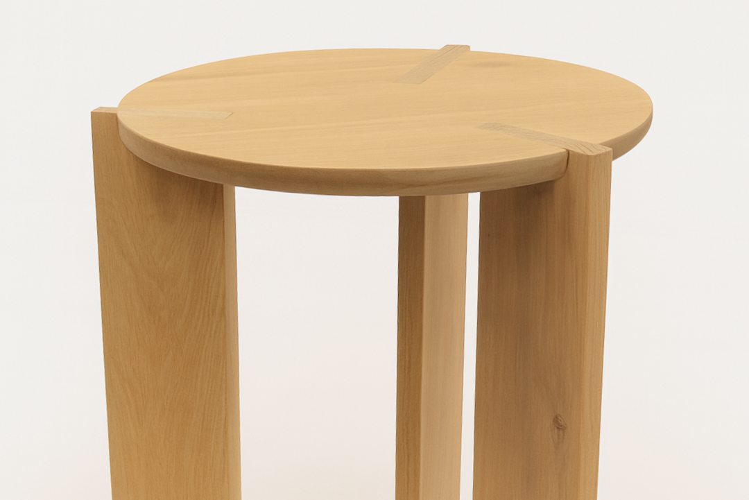 Wooden stool with a round seat on a white background